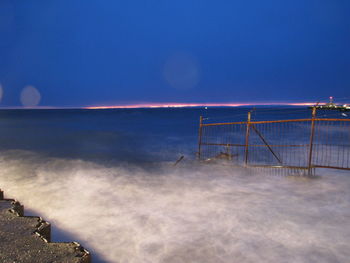 Scenic view of sea against sky at night