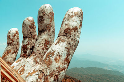 Close-up of rocks against sky