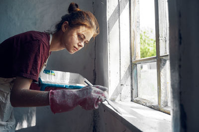 Side view of man working at home