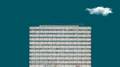 Low angle view of buildings against blue sky