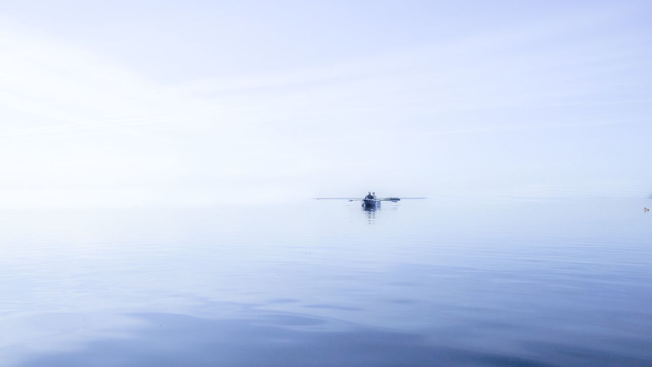 VIEW OF BOAT IN SEA AGAINST SKY