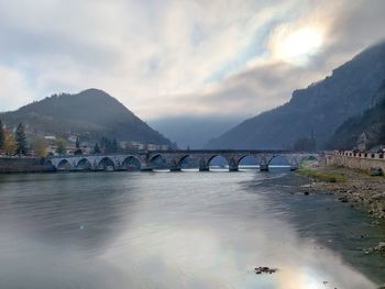 Bridge over river against sky