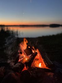 Close-up of campfire at sunset
