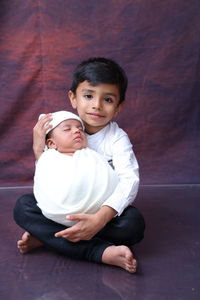 Siblings, new born n his elder brother 