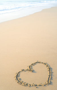 High angle view of heart shape on beach