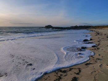 Scenic view of beach against sky