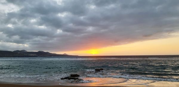 Scenic view of sea against sky during sunset