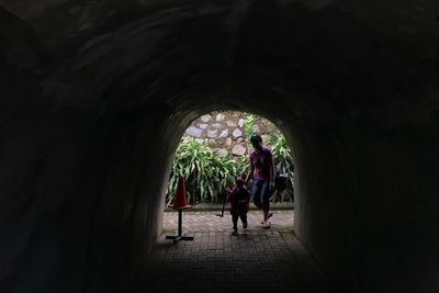 People walking in tunnel