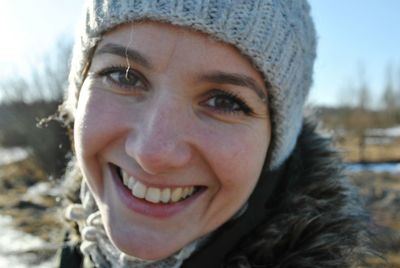Portrait of smiling woman in snow