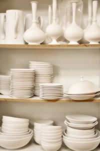 Close-up of stack of bowls on shelf