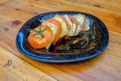 High angle view of fish in plate on table