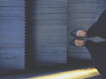 Full length of woman standing on wall