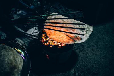 High angle view of meat on barbecue grill