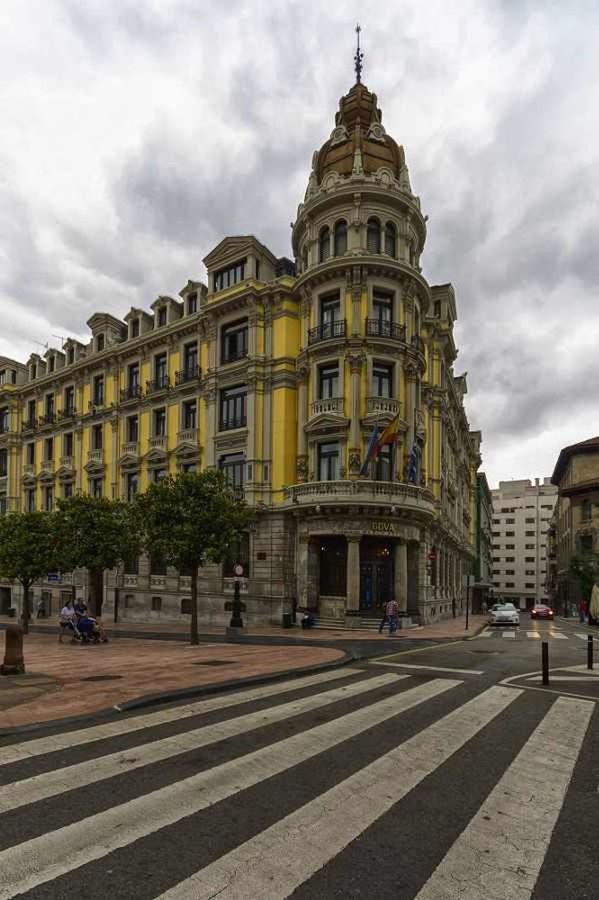 architecture, building exterior, built structure, sky, city, cloud - sky, travel destinations, incidental people, facade, street, famous place, city life, cloud, travel, history, tourism, capital cities, building, town square, cloudy