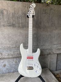 View of guitar against wall