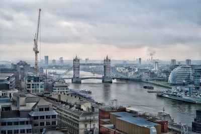 Tower bridge over river in city