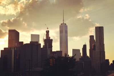 Modern buildings in city during sunset