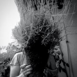 Close-up of hands on tree