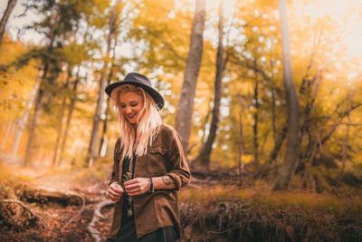 Woman standing in forest