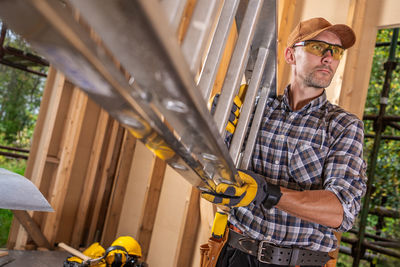 Side view of man working in workshop