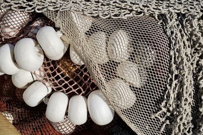 Close-up of fishing net in basket