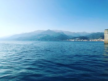 Scenic view of sea against clear blue sky