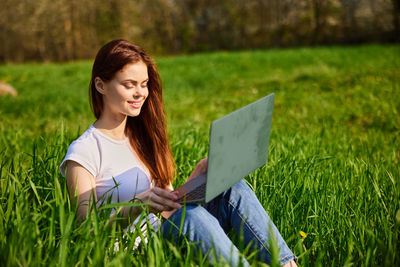 Young woman using digital tablet