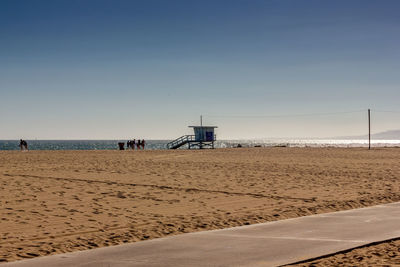 Scenic view of beach against clear sky