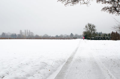 Scenic view of snow covered landscape against clear sky