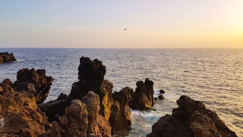 Scenic view of sea against sky during sunset