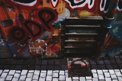 Close-up of cat on brick wall
