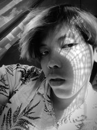 Close-up portrait of cute girl at home