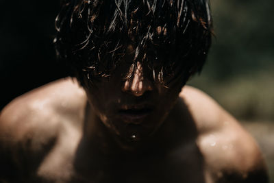 Close-up portrait of shirtless man