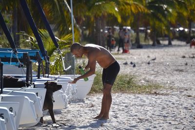 Rear view of woman standing against blurred background