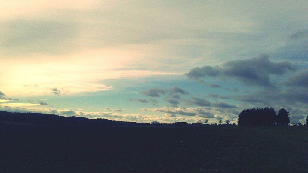 silhouette, sky, cloud - sky, tranquil scene, sunset, tranquility, scenics, beauty in nature, cloudy, landscape, nature, cloud, dusk, dark, idyllic, outdoors, weather, no people, copy space, overcast