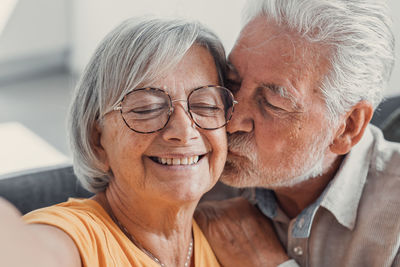 Portrait of young man sitting at home