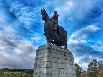 Low angle view of statue against sky