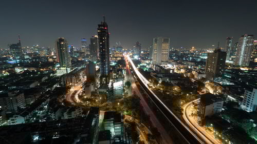 High angle view of illuminated city buildings at night