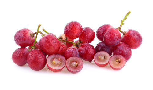 Close-up of grapes against white background