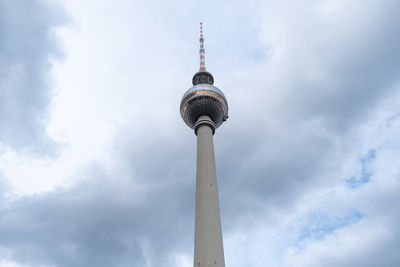 Low angle view of communications tower against sky