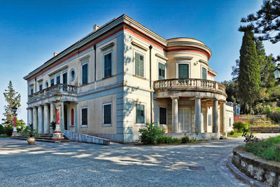 Building by street against clear sky