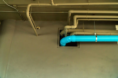 The location of the plumbing. the plumbing system uses blue pvc pipes to connect to each other.