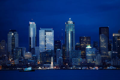 Illuminated buildings in city at night