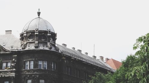 Low angle view of buildings against clear sky
