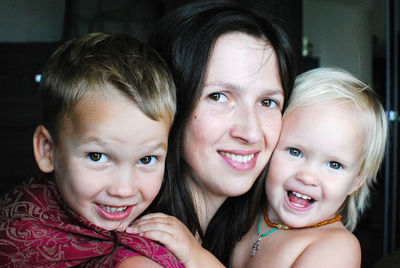 Portrait of happy mother with daughter and son 