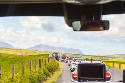 Road seen through car windshield