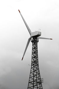 Low angle view of windmill against sky