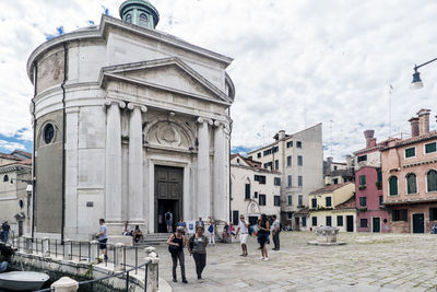 People in front of historical building