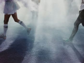 People running on dirt field