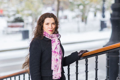 Portrait of young woman standing outdoors